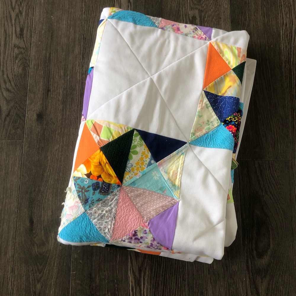 Handmade White Patchwork Quilt with Multicolor Triangle Accents